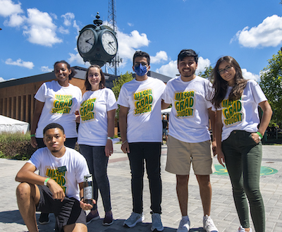 group of grad students by the clock