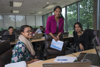 Three graduate students in a class