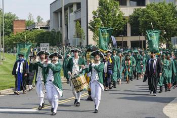Class of 2022 procession on the Fairfax Campus during Spring Commencement ceremony.